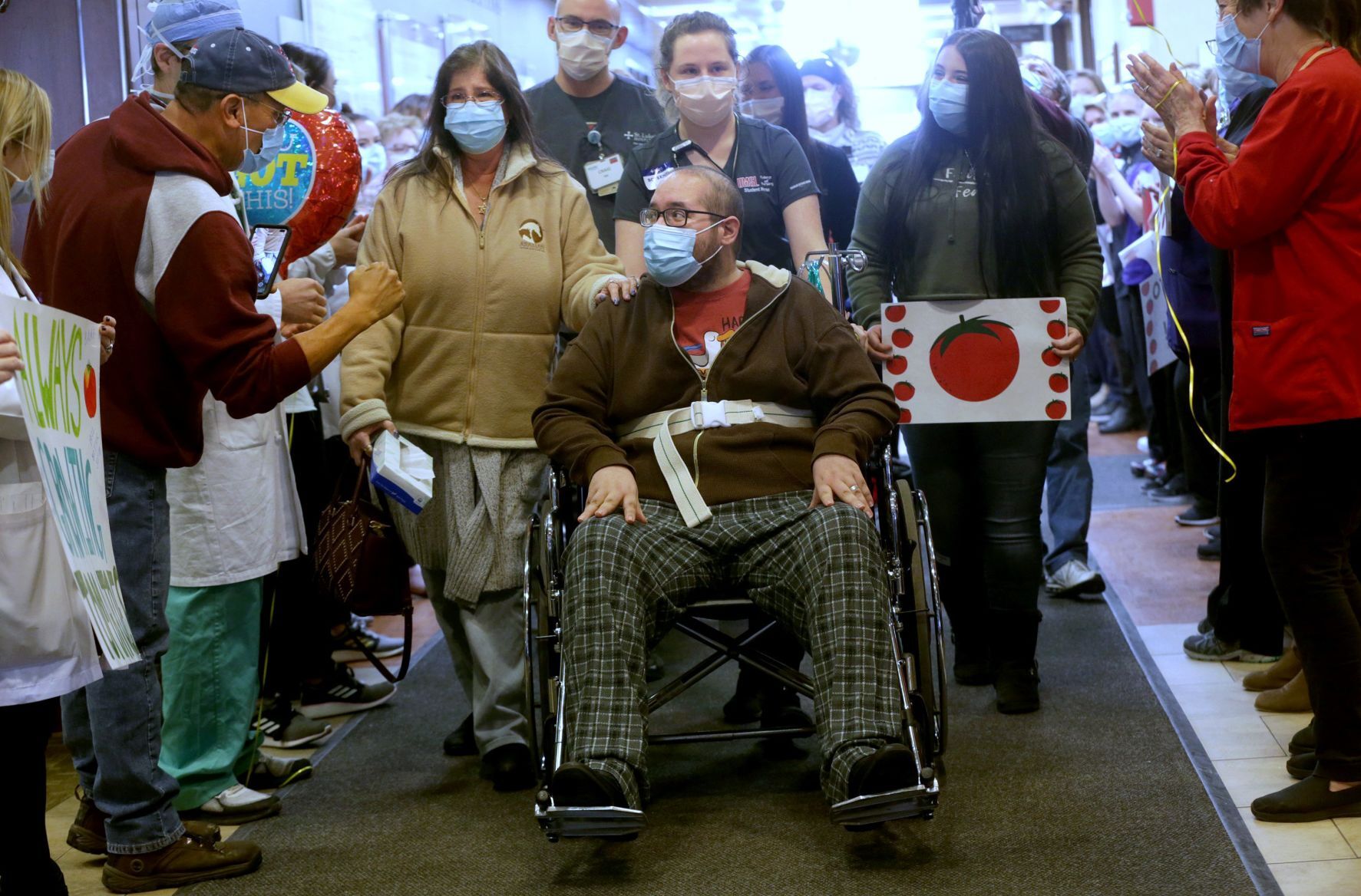 Staff cheers COVID-19 survivor Josh Miller's discharge from St. Luke's Hospital